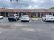 Exterior view of townhomes, showcasing parking and well-maintained landscaping at 6446 71St N St, Pinellas Park, FL 33781