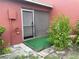Cozy patio area with sliding screen door and view of the surrounding greenery at 6446 71St N St, Pinellas Park, FL 33781