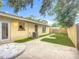 Backyard with patio, artificial turf accents, and shade trees, creating a serene outdoor space at 6511 3Rd Ne Ave, Bradenton, FL 34208