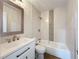Bathroom features a vanity with modern fixtures and a tub with mosaic tile accents, combining style and functionality at 6511 3Rd Ne Ave, Bradenton, FL 34208