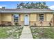 Inviting home with neat landscaping and a clean walkway leading to a welcoming front door at 6511 3Rd Ne Ave, Bradenton, FL 34208