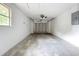Spacious garage with a functional door and ample room for parking and storage at 6511 3Rd Ne Ave, Bradenton, FL 34208