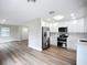 Open-concept kitchen with white cabinetry and modern stainless steel appliances at 6511 3Rd Ne Ave, Bradenton, FL 34208