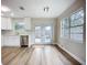 Modern kitchen showcasing stainless steel appliances, white cabinetry, and hardwood floors at 6511 3Rd Ne Ave, Bradenton, FL 34208