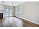 Well-lit kitchen area featuring hardwood floors and a glass door to the backyard at 6511 3Rd Ne Ave, Bradenton, FL 34208