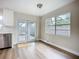 Bright kitchen with hardwood floors and glass doors leading to the backyard at 6511 3Rd Ne Ave, Bradenton, FL 34208