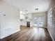 Bright kitchen featuring hardwood floors, stainless steel appliances, and white cabinets at 6511 3Rd Ne Ave, Bradenton, FL 34208