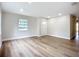 Bright and airy living room with new vinyl plank flooring, fresh paint, and lots of light at 6511 3Rd Ne Ave, Bradenton, FL 34208