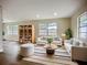 Spacious living room with stylish furniture, large windows, and new vinyl plank flooring at 6511 3Rd Ne Ave, Bradenton, FL 34208
