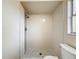 Shower with decorative pebble flooring and mosaic tile accents, offering a stylish bathroom feature at 6511 3Rd Ne Ave, Bradenton, FL 34208
