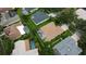 Aerial view of homes with pools, manicured lawns, and mature trees create an inviting neighborhood at 8731 Tantallon Cir, Tampa, FL 33647
