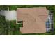 An overhead view of a home and lanai including a screened in pool and a well kept lawn at 8731 Tantallon Cir, Tampa, FL 33647
