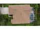 An overhead view of a home and lanai including a screened in pool and a well kept lawn at 8731 Tantallon Cir, Tampa, FL 33647