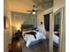Cozy bedroom with a ceiling fan, stylish decor, and ample natural light at 8731 Tantallon Cir, Tampa, FL 33647