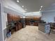 Spacious kitchen featuring stainless appliances, wood cabinetry, and a breakfast bar at 8731 Tantallon Cir, Tampa, FL 33647