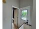 Mudroom featuring tile floors and access to the backyard at 8731 Tantallon Cir, Tampa, FL 33647