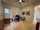 Bright office space with a ceiling fan, natural light, and neutral paint at 8731 Tantallon Cir, Tampa, FL 33647