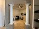 Home office featuring classic columns, tile floors, and abundant natural light at 8731 Tantallon Cir, Tampa, FL 33647
