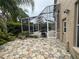 A screened patio area leads to a pool at 8731 Tantallon Cir, Tampa, FL 33647