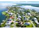 Breathtaking aerial view showcases a waterfront community with homes, canals, and lush landscaping on the coast at 101 Carlyle Dr, Palm Harbor, FL 34683