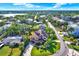 Beautiful waterfront home boasts lush landscaping, a large deck, and neighborhood water access at 101 Carlyle Dr, Palm Harbor, FL 34683