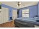 Comfortable bedroom with ample closet space and a ceiling fan at 101 Carlyle Dr, Palm Harbor, FL 34683