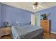 Comfortable bedroom with hardwood floors and ceiling fan at 101 Carlyle Dr, Palm Harbor, FL 34683