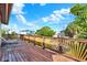 Wide wooden deck with stylish railings and plenty of space to relax while enjoying neighborhood views at 101 Carlyle Dr, Palm Harbor, FL 34683