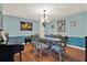 Charming dining room with hardwood floors and seating for six at 101 Carlyle Dr, Palm Harbor, FL 34683