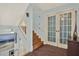 Hallway leading to stairs and balcony at 101 Carlyle Dr, Palm Harbor, FL 34683