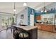 Bright and airy kitchen with a large island, stainless steel appliances, and a dining area with natural light at 101 Carlyle Dr, Palm Harbor, FL 34683