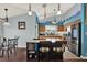 Well-equipped kitchen with granite countertops, stainless steel appliances, and a breakfast bar overlooking the dining area at 101 Carlyle Dr, Palm Harbor, FL 34683