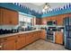 Modern kitchen with stainless steel appliances, granite countertops, and ample cabinet space, perfect for cooking at 101 Carlyle Dr, Palm Harbor, FL 34683
