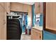 This laundry room features custom cabinets for storage, a utility sink, and a modern washer and dryer at 101 Carlyle Dr, Palm Harbor, FL 34683
