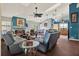 Cozy living room featuring a fireplace, comfortable seating, and a dining area, great for entertaining at 101 Carlyle Dr, Palm Harbor, FL 34683