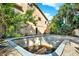 This outdoor space shows a pool in need of cleaning, surrounded by a patio and greenery, offering potential for revitalization at 101 Carlyle Dr, Palm Harbor, FL 34683