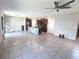 Open kitchen featuring a large island, modern appliances, and seamless integration with the living area at 10221 Carloway Hills Dr, Wimauma, FL 33598