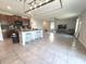 Open kitchen featuring a large island, modern appliances, and seamless integration with the living area at 10221 Carloway Hills Dr, Wimauma, FL 33598