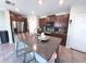 Kitchen with stainless steel appliances, granite countertops, a center island with bar seating, and ample cabinet space at 10221 Carloway Hills Dr, Wimauma, FL 33598