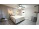 Inviting main bedroom featuring a neutral palette, stylish light fixtures, and a ceiling fan at 10221 Carloway Hills Dr, Wimauma, FL 33598