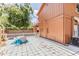 View of the expansive backyard with a brick exterior and white picket fence at 10520 Winrock Pl, Tampa, FL 33624