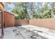 Fenced backyard area offering privacy and ample space for outdoor activities at 10520 Winrock Pl, Tampa, FL 33624
