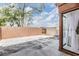 Large backyard with a wooden fence, shed, and some trees at 10520 Winrock Pl, Tampa, FL 33624