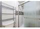 Updated bathroom featuring a tiled shower with glass doors and a modern toilet at 10520 Winrock Pl, Tampa, FL 33624