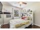 Charming bedroom with a window, hardwood floors, and decorative accents at 10520 Winrock Pl, Tampa, FL 33624