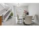 Stylish dining area with modern chandelier and view of stairs at 10520 Winrock Pl, Tampa, FL 33624