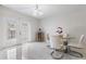 Bright dining area featuring tile floors, French doors, and a glass table with seating for four at 10520 Winrock Pl, Tampa, FL 33624