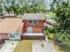 Charming two-story home featuring a spacious backyard and a private outdoor patio area at 10520 Winrock Pl, Tampa, FL 33624