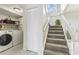 Functional laundry area and stairway featuring natural light at 10520 Winrock Pl, Tampa, FL 33624