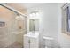 Bright bathroom featuring glass enclosed walk-in shower with white marble walls at 1100 Snell Isle Ne Blvd, St Petersburg, FL 33704